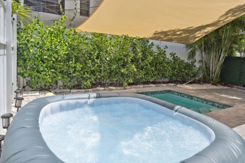 A hot jacuzzi for four is next to a cold pool, it’s perfect for health benefits.
