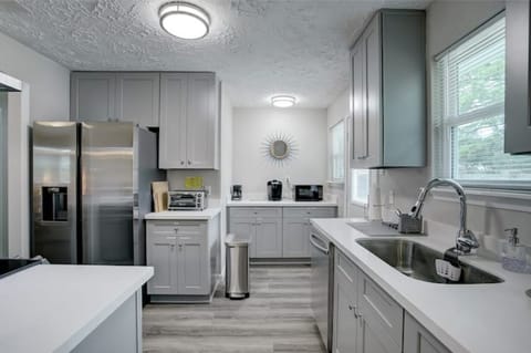From the Dining Room, Admire the Fully Stocked Kitchen