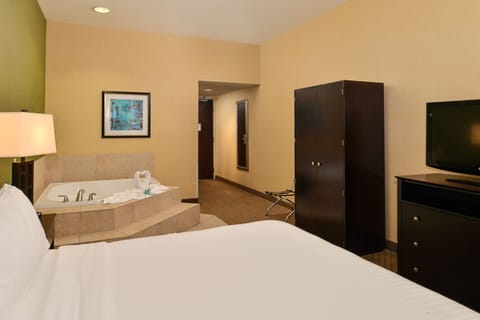 Suite, 1 King Bed, Jetted Tub | In-room safe, desk, iron/ironing board, free cribs/infant beds