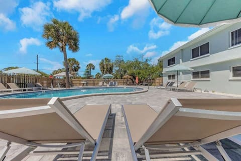 Large Heated Pool, with plenty of lounge chairs,  umbrellas and dinning tables! As well as a brand new Weber BBQ Grill, fire pit and floats for the pool! 