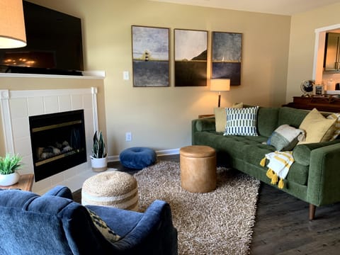 A wider view of the living space.  55" TV and cozy seating for 4. 