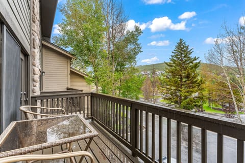 - Step onto the private balcony with seating and fresh mountain air  
- Take in scenic views of trees and rolling hills nearby  
- Perfect spot for morning coffee or evening relaxation