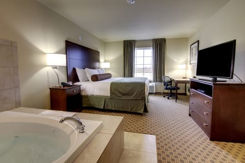 Room, 1 King Bed with Whirlpool, Non Smoking | Premium bedding, in-room safe, desk, laptop workspace