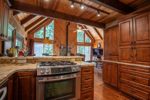 Kitchen opens up living and dining areas