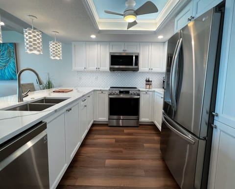 Renovated and fully equipped kitchen with all the necessities an - Renovated and fully equipped kitchen with all the necessities and extras you could need to cook your favorite meals and snacks.