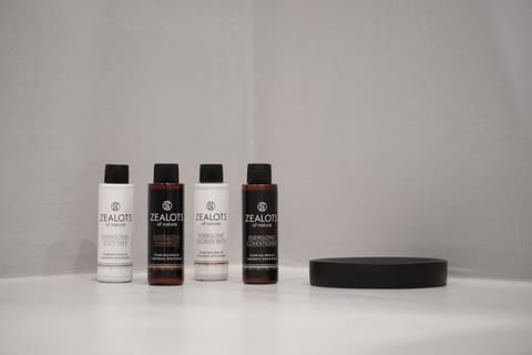 Deluxe Suite with Outdoor Mini Plunge Pool and Caldera View | Bathroom | Slippers