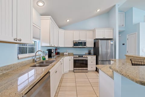 Cook and connect in a bright, open kitchen designed for effortless meals and gatherings