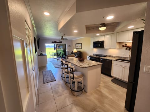 Kitchen, living room & patio on the golf course 