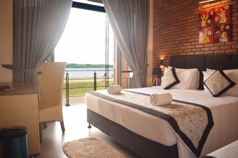 Deluxe Double Room, Balcony | Minibar, desk, laptop workspace, blackout drapes