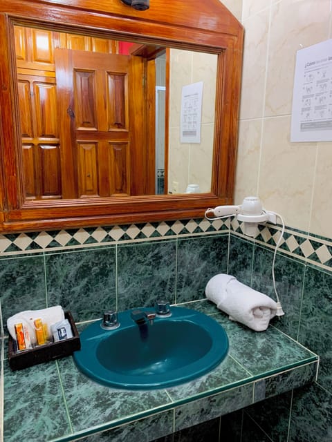 Quadruple Room | Bathroom | Shower, free toiletries, hair dryer, towels