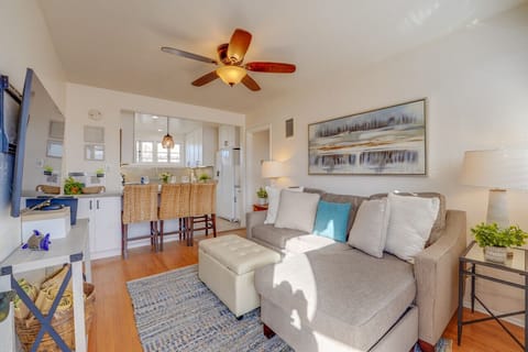 Living room has a pull out couch and smart tv with Roku.