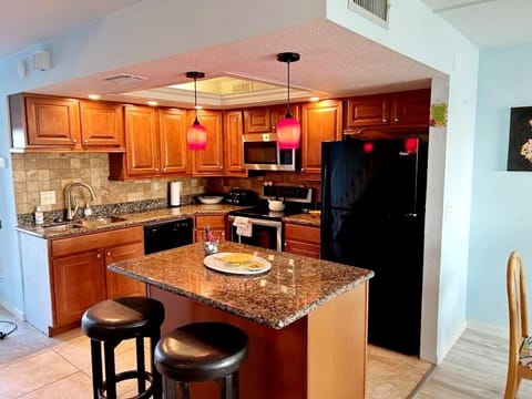 Spacious gourmet kitchen stocked with all cooking necessities