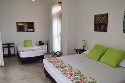 Triple Room | Minibar, in-room safe, individually furnished, free cribs/infant beds