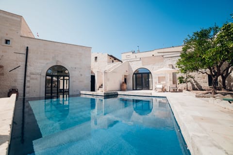 Seasonal outdoor pool, open 8:30 AM to 6:30 PM, pool umbrellas