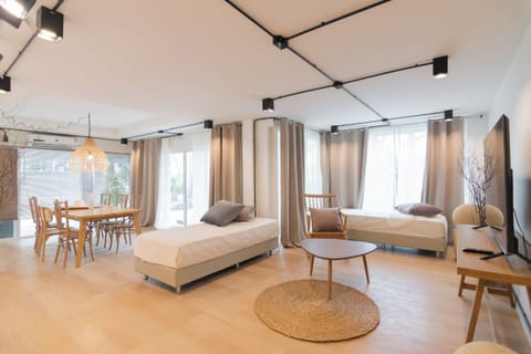 Family Suite | Living area | 55-inch Smart TV with cable channels
