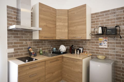 Comfort Condo | Private kitchen | Espresso maker, coffee/tea maker, electric kettle, dining tables