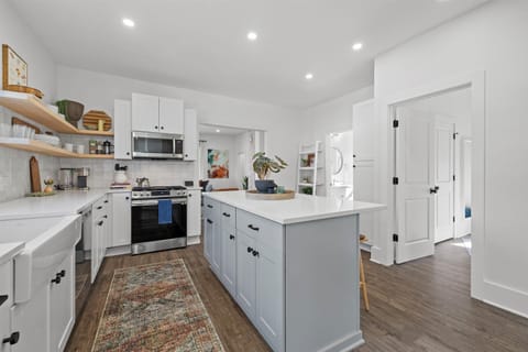 Fully stocked kitchen with counter seating and built in breakfast nook