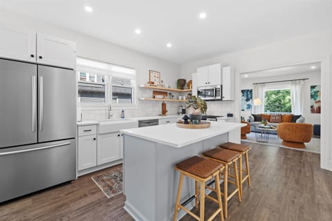 Fully stocked kitchen with counter seating and built in breakfast nook