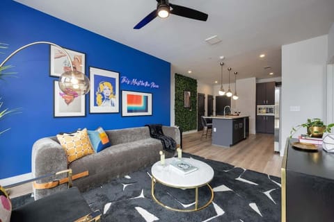 Open concept living area with floor to ceiling windows! Features designer furniture and smart TV!
