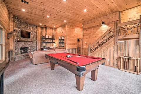 Enjoy the cabins game room with a pool table and TV
