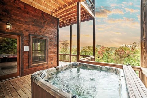 Relax in the hot tub while taking in the serene mountain views after a day of exploring