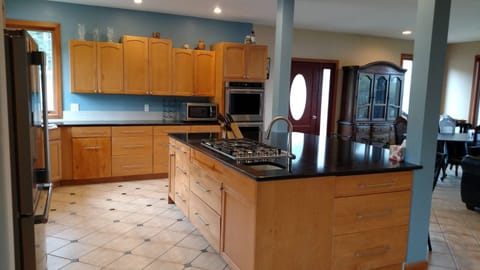 5-burner cooktop in the oversized kitchen.