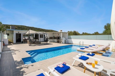 Tranquil Poolside Escape Under the Greek Sky