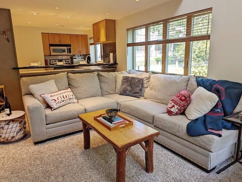 Our living room is right next to our kitchen and bar seating.