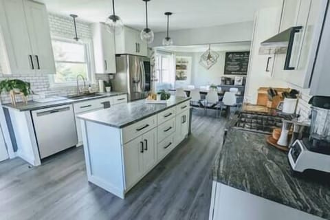 Fully stocked kitchen with utensils, dishes, cookware, etc.