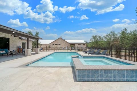 Amazing pool patio with lounging, splashing, and soaking in the hot tub.