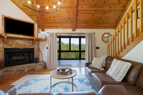 Spacious, open and inviting. The living room opens to the screened in porch to enjoy beautiful weather. 