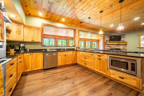 Experience culinary delight with a six-burner stove, generous seating, and stunning mountain vistas!