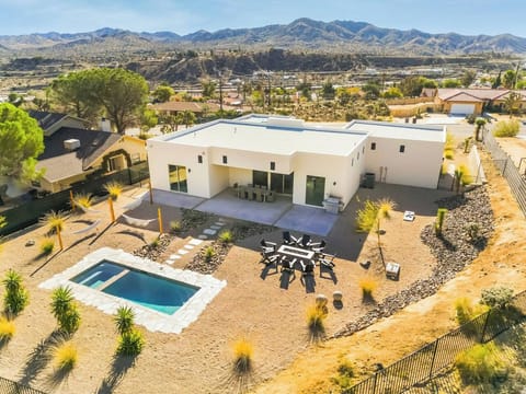 Whether you want to take a dip in the pool, lounge in the spa, sit by the fire, this backyard has it all.