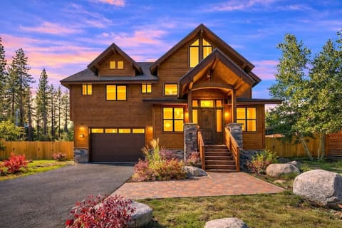 High-end South Lake Tahoe mountain lodge surrounded by towering pines, featuring a spacious design and peaceful setting near hiking, biking and snowshoeing trails.