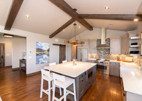 Main entry (left) opening to the main level great room and kitchen / dining area