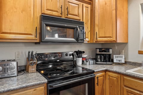 The fully equipped kitchen is perfect for crafting a delicious meal.
