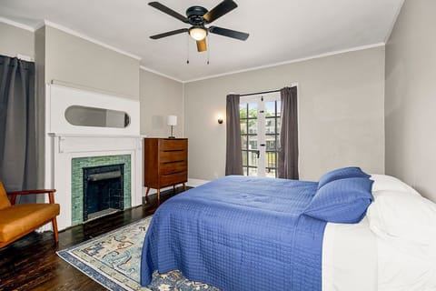 This spacious 2nd floor unit boasts 2 bedrooms, a full bath, kitchen, office and living rooms, along with an in-unit laundry. This bedroom allows access to the private front deck.
