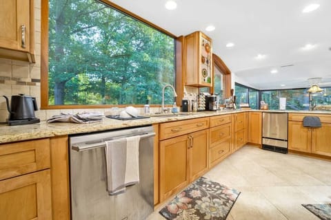 The main kitchen overlooks the pond and the Summer Kitchen.