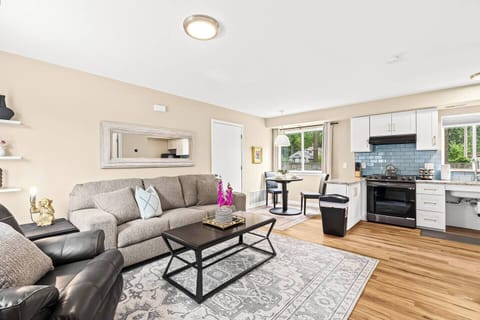 Relax in our inviting living room furnished with cozy seating and a smart TV for your entertainment.