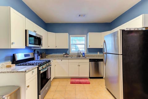 fully equipped kitchen w/ stainless appliances + complimentary coffee & tea 