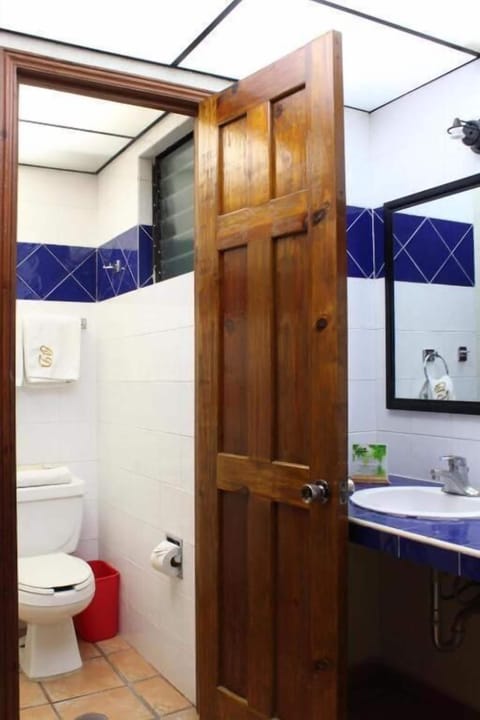 Bathtub, eco-friendly toiletries, towels, toilet paper