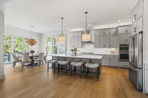 Kitchen and Dining with room for 10 at the table and 4 at the counter.