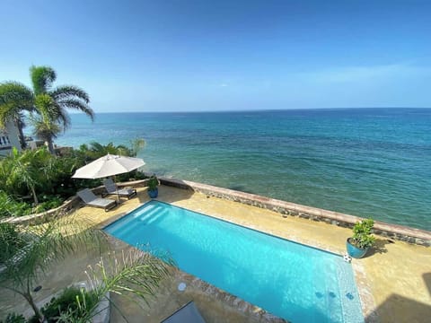View of pool area from Villa 2 balcony. 
