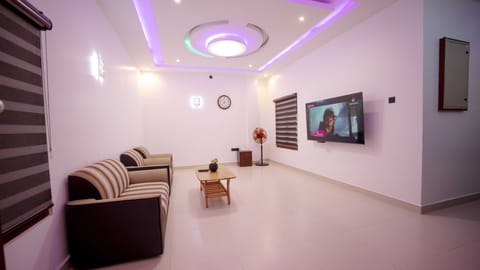 Family Apartment | Living area | 40-inch flat-screen TV with satellite channels