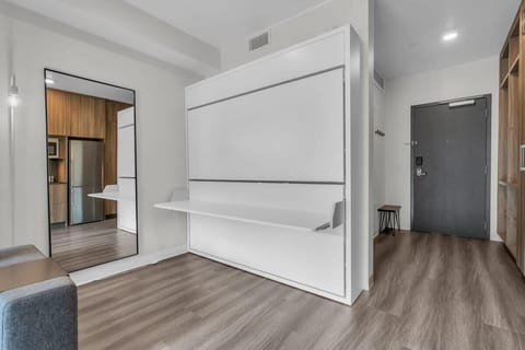 A desk/eating area can be turned into a sleeping space with pull-down twin bunk beds, a great example of the smart design this home features.