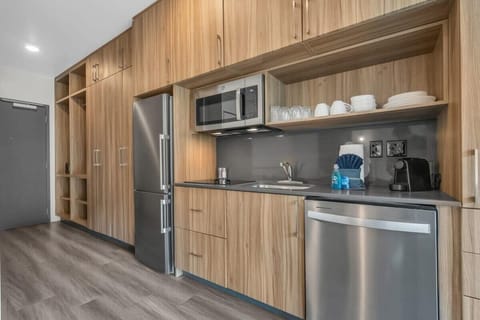 The fully stocked kitchen has stainless steel appliances, Nespresso, a toaster oven, and basic cookware so you can easily prepare delicious meals.