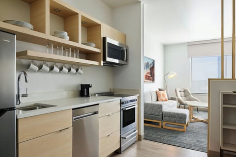 Suite, 1 Bedroom | Private kitchen | Full-size fridge, microwave, stovetop, dishwasher