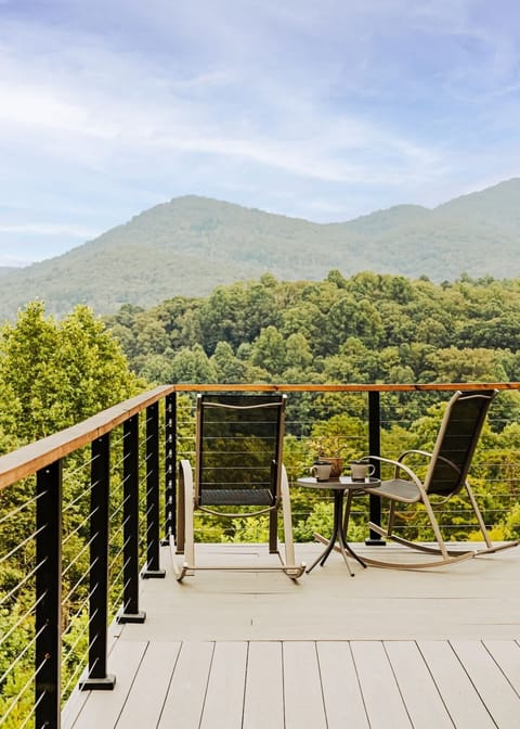 Start your day with coffee and mountain views from this peaceful deck perch, rockers included.