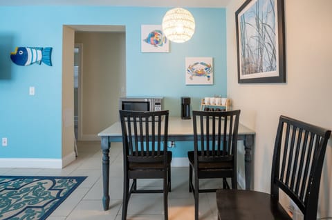 Ground level eat-in living room with microwave, coffee station and mini-fridge