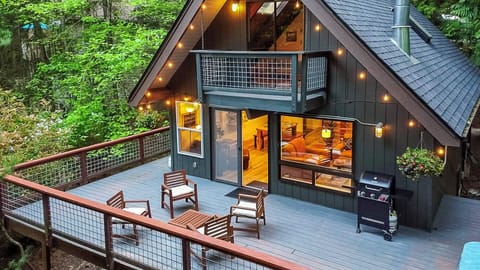 This beautiful A-frame in Sudden Valley is the perfect combination of "getting away from it all" and "coveniently close to Bellingham". The huge, private deck has a hot tub, BBQ, and comfy patio furniture for you to enjoy. :)